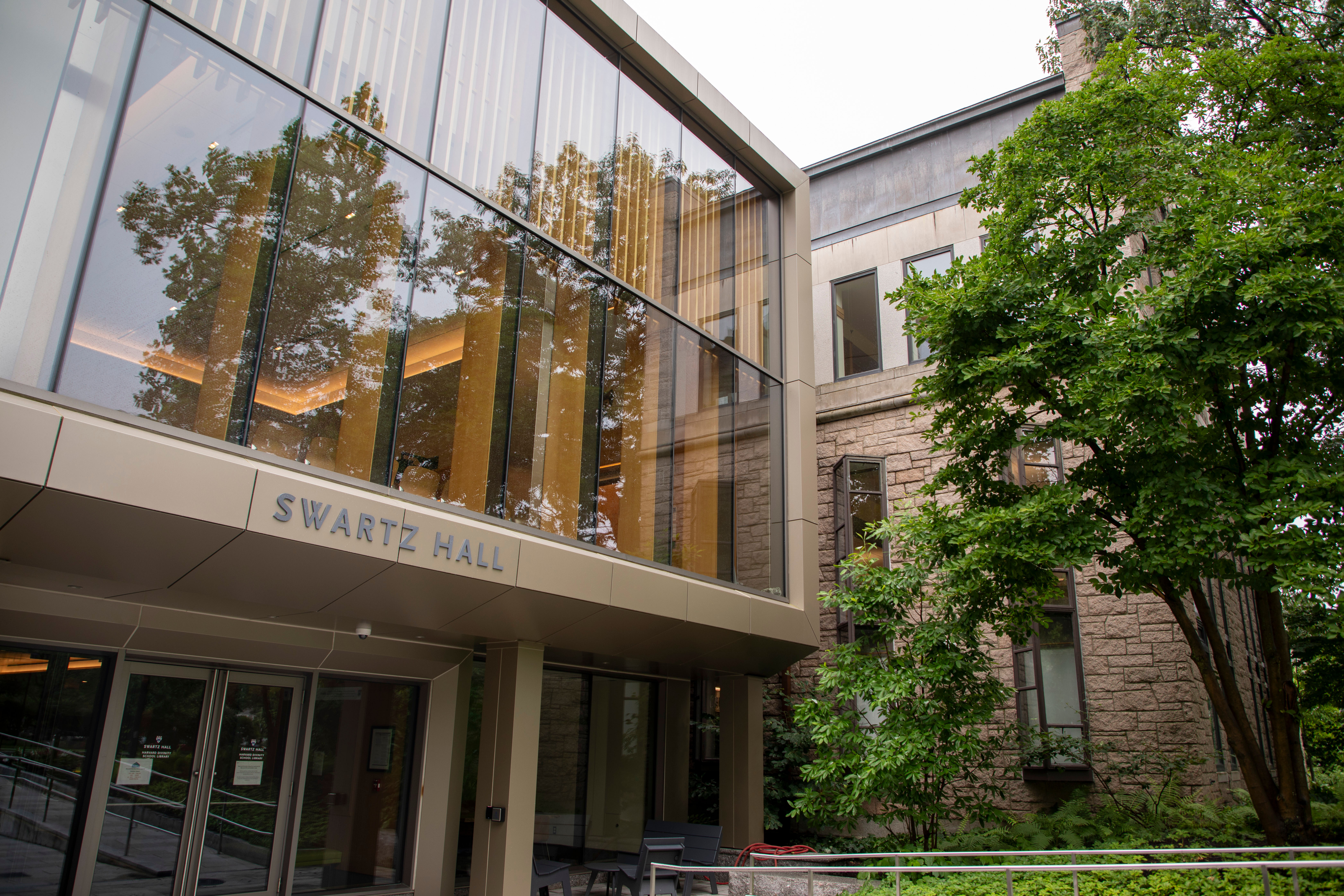 The entrance to Swartz Hall. A large tree stands near the entrance.