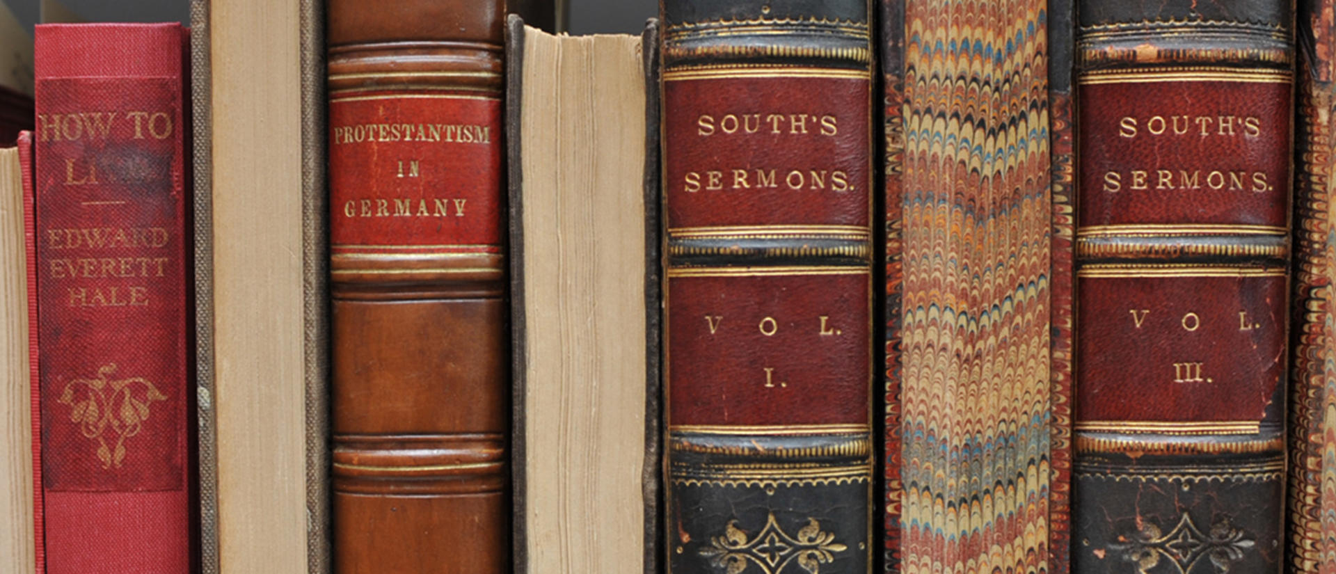 Close-up of a library shelf with old books.
